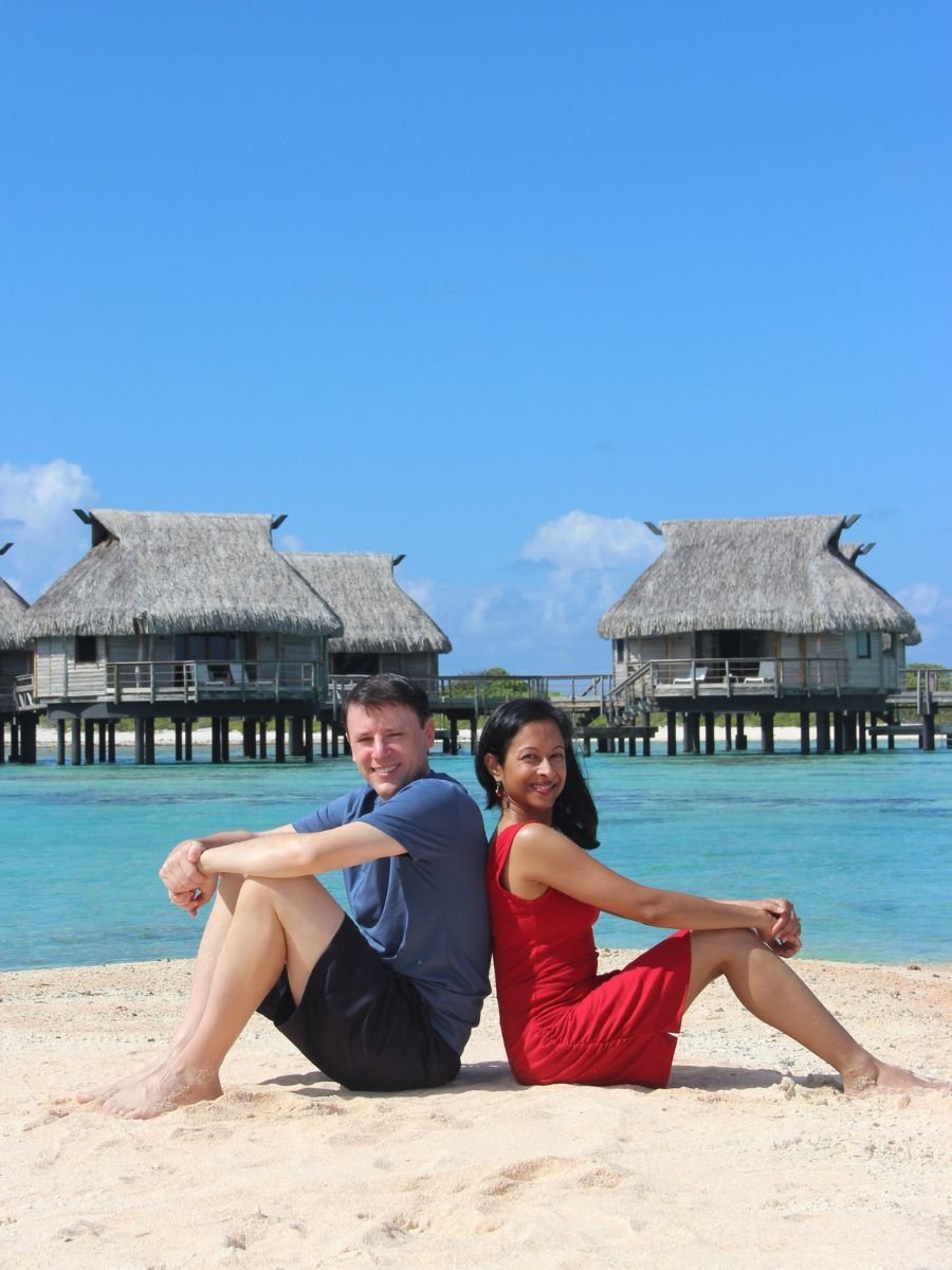 Dr. Ramona Ramdath with her husband with Menieres Disease posing by the beach